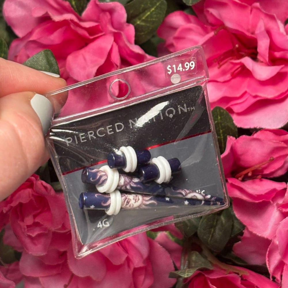 Purple and white gauges by Pierced Nation, size 4G

Brand new in sealed package